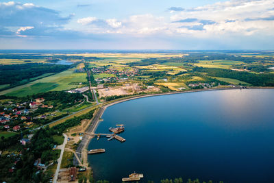 Flying drone over large lake in countryside