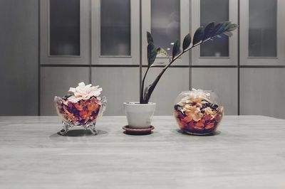 Close-up of flower vase on table at home