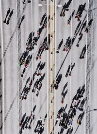 Directly above shot of people walking on road