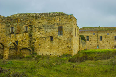 Low angle view of old building against sky