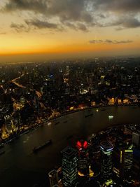 High angle view of illuminated city buildings at night