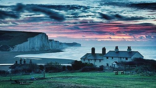 Scenic view of sea against cloudy sky