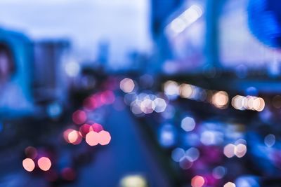 Defocused image of illuminated lights at night