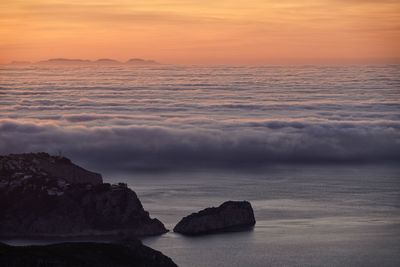 Scenic view of sea against sky during sunset