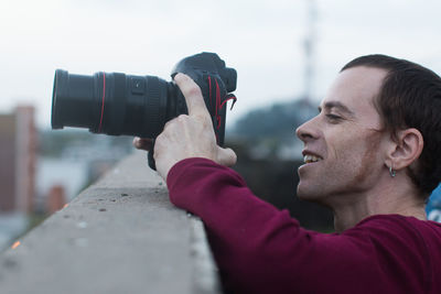 Portrait of man photographing