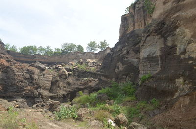 Rock formation on mountain against sky
