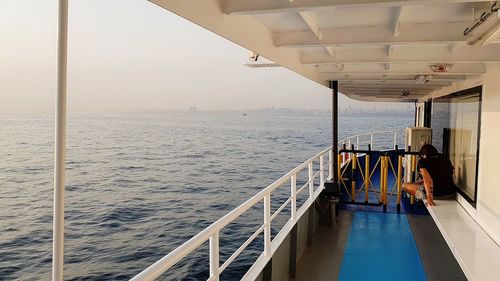 Scenic view of boat sailing on sea against sky