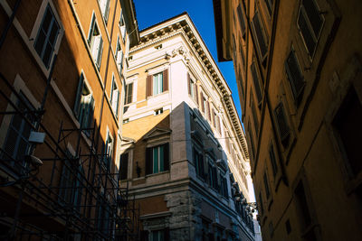 Low angle view of buildings in city against sky