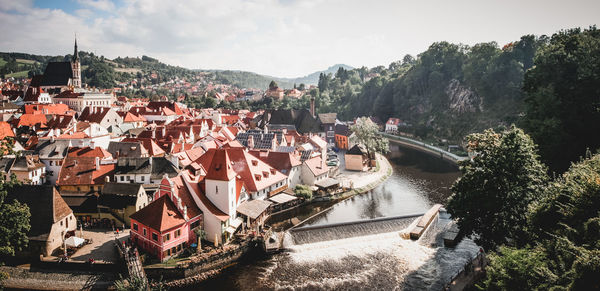 Panoramic view of river and city against sky