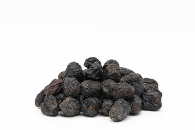 Close-up of blueberries against white background