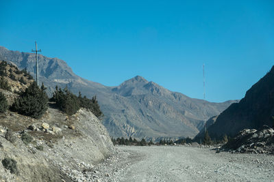 Scenic view of mountains against clear blue sky