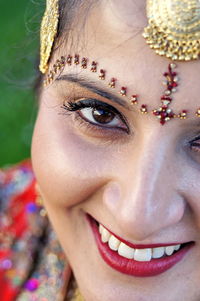 Close-up portrait of a smiling young woman