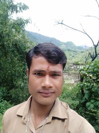 Portrait of woman against plants