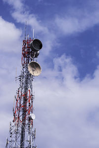 Low angle view of communications tower against sky