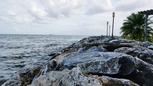 Scenic view of sea against cloudy sky