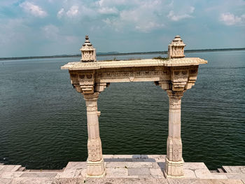 Bridge over sea against sky