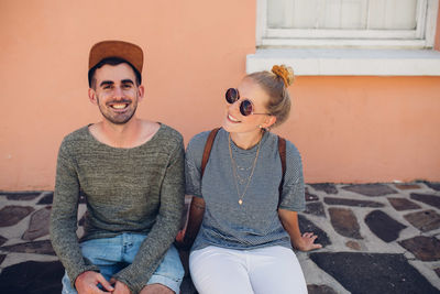 Portrait of young couple sitting at home