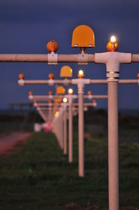 Illuminated built structure against sky at night