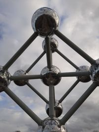 Low angle view of chain against sky