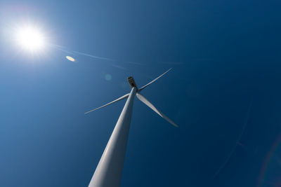 Low angle view of wind turbine against sky