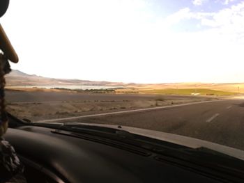 Road seen through car windshield