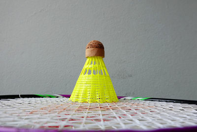 Close-up of multi colored pencils on table against wall