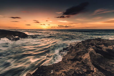 Scenic view of sea at sunset