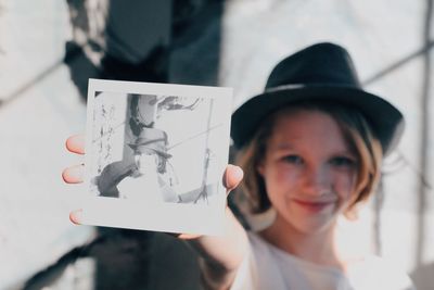 Close-up portrait of smiling young woman