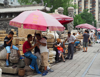 Group of people on wet street in rainy season