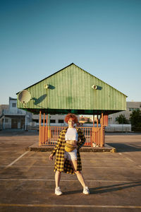 Full length portrait of boy against clear sky