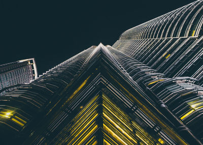 Low angle view of illuminated building at night