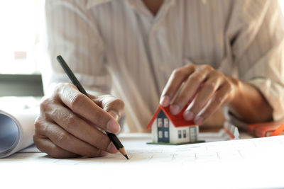 Close-up of man working on table