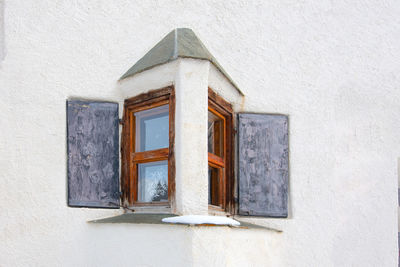 Low angle view of window on old building