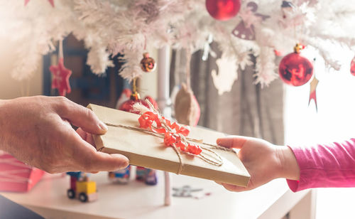 Close-up of hand holding christmas decoration