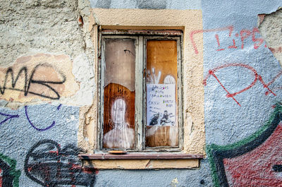 Graffiti on wall of old building