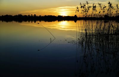 Scenic view of sunset over lake