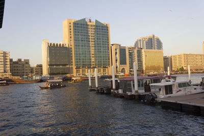 River amidst buildings against sky in city