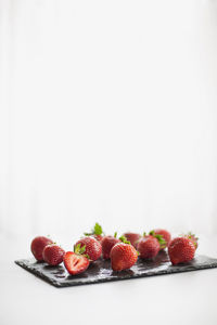 Close-up of strawberries against white background