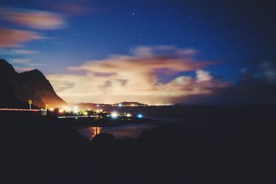 Scenic view of sea against sky at night