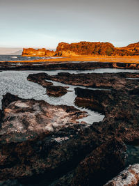 Scenic view of rock formations against sky