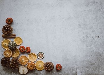 High angle view of coins on table against wall