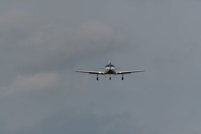 Low angle view of airplane flying in sky