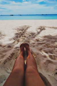 Low section of woman on beach