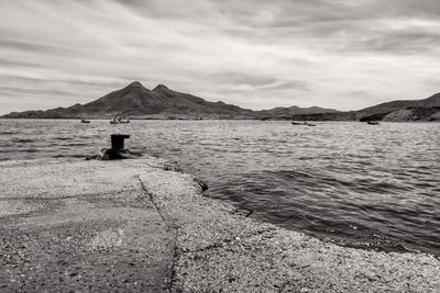 Scenic view of dock and sea against sky