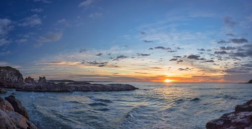 Scenic view of sea at sunset