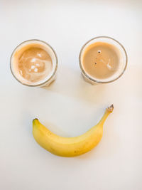 High angle view of coffee cup on white background