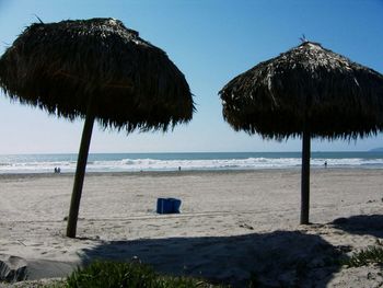 Scenic view of beach against blue sky