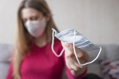 Portrait of young woman wearing hat