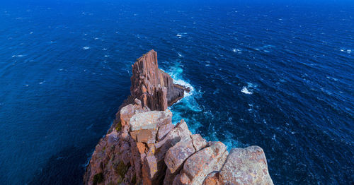 High angle view of rock formation in sea