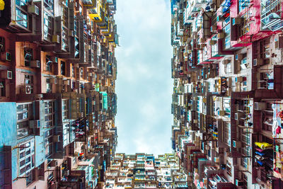 Low angle view of buildings against sky in city